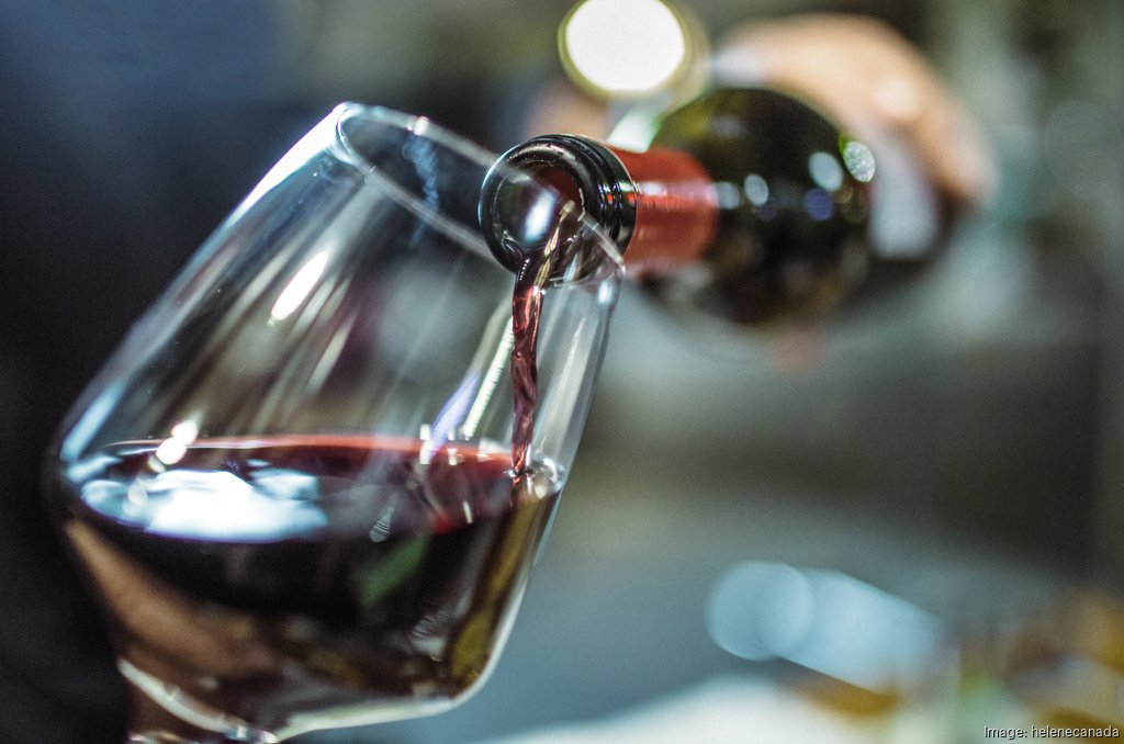 Close up of red wine being poured into a wine glass